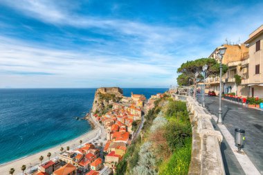 Awesome seaside and town Scilla with old medieval castle on rock Castello Ruffo, colorful traditional typical italian houses on Mediterranean Tyrrhenian sea coast shore, Calabria, Southern Italy