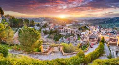 Fantastic sunrise over old famous medieval village Stilo in Calabria. View on city and valley. Location: Stilo, Southern Italy. Calabria. Europe