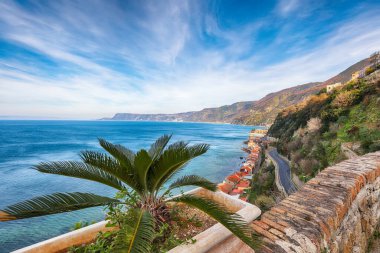 Awesome seaside and village Scilla with old medieval castle on rock Castello Ruffo, colorful traditional typical italian houses on Mediterranean Tyrrhenian sea coast shore, Calabria, Southern Italy