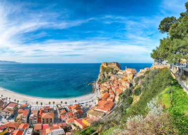 Awesome seaside and village Scilla with old medieval castle on rock Castello Ruffo, colorful traditional typical italian houses on Mediterranean Tyrrhenian sea coast shore, Calabria, Southern Italy