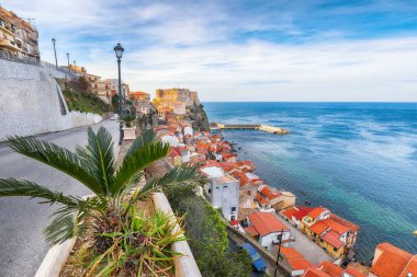 Awesome seaside and village Scilla with old medieval castle on rock Castello Ruffo, colorful traditional typical italian houses on Mediterranean Tyrrhenian sea coast shore, Calabria, Southern Italy