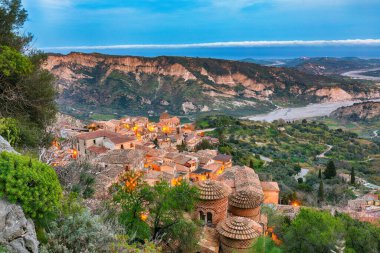 Amazing Sunset over old famous medieval village Stilo in Calabria. View on church and city. Southern Italy. Sicily. Europe.