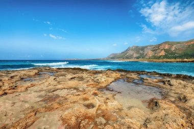 Outstanding seascape of Isolidda Beach near San Vito cape. Popular travel destination of Monte Cofano National Park. Location: San Vito Lo Capo, Province of Trapani, Sicily, Italy, Europe