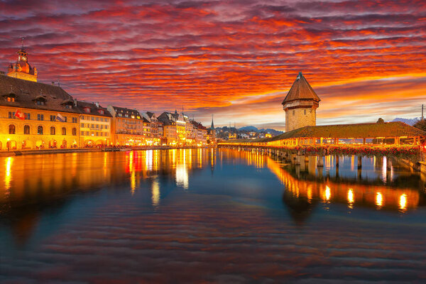 Marvelous historic city center of Lucerne with famous buildings and old wooden Chapel Bridge (Kapellbrucke). Popular travel destination . Location: Lucerne, Canton of Lucerne, Switzerland, Europe