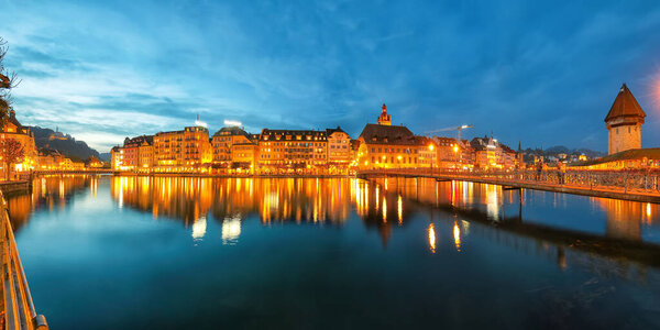 Beautiful historic city center of Lucerne with famous buildings and promenade during night.. Popular travel destination . Location: Lucerne, Canton of Lucerne, Switzerland, Europe
