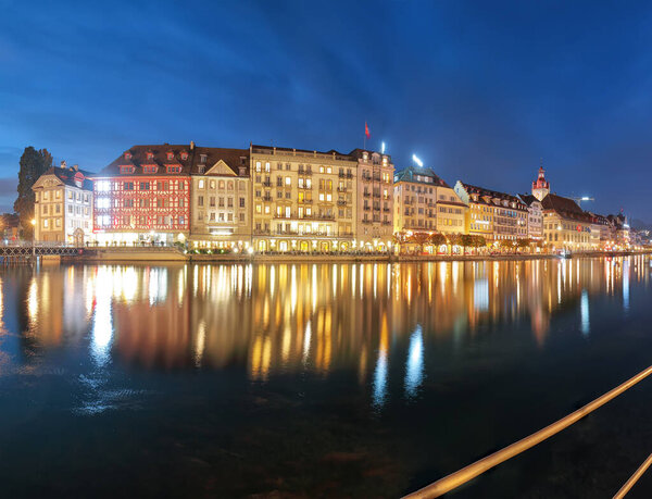 Beautiful historic city center of Lucerne with famous buildings and promenade during night.. Popular travel destination . Location: Lucerne, Canton of Lucerne, Switzerland, Europe