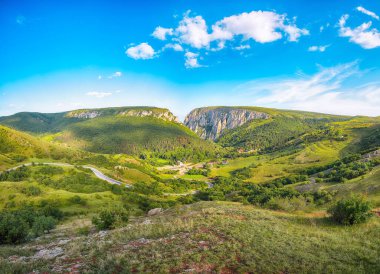 Amazing view of Turda Gorge (Cheile Turzii) natural reserve with marked trails for hikes on Hasdate river.  Location: near Turda close to Cluj-Napoca, in Transylvania, Romania, Europe clipart