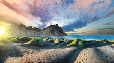 İzlanda 'da Stoksnes Burnu' nda muhteşem siyah kum tepeleri olan etkileyici bir gün batımı. Konum: Stoksnes Pelerini, Vestrahorn (Batman Dağı), İzlanda, Avrupa.