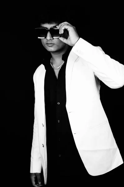Handsome man touching eyeglasses