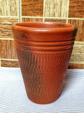 Clay made glass for drinking water, tea, coffee, soup, milk. Traditional craftsmanship item made by mud or clay that good for health. Best glass or mug for summer season to keep water cold naturally clipart