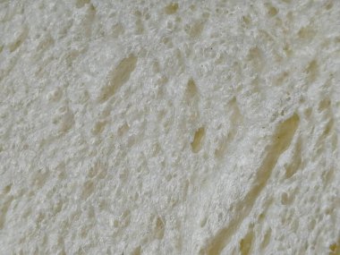 Buğday ekmeği dokusunu ve yapısını kapatın. Güne sağlıklı bir şekilde başlamak için taze ev yapımı yemek.