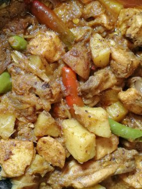 Bresse chicken curry is the most testier food item in the world. Different parts of cooked chicken curry mixed with different kinds of seasonal vegetables clipart