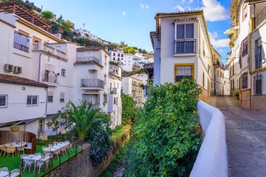 Setenil de las Bodegas, rustic village with cave houses on a sunny day with blue sky, in the province of Cadiz, Andalusia, Spain clipart