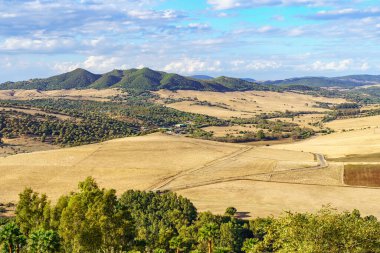 Landscape of countryside and mountains in the valley of the Sierra de Grazalema in Cadiz, Spain clipart