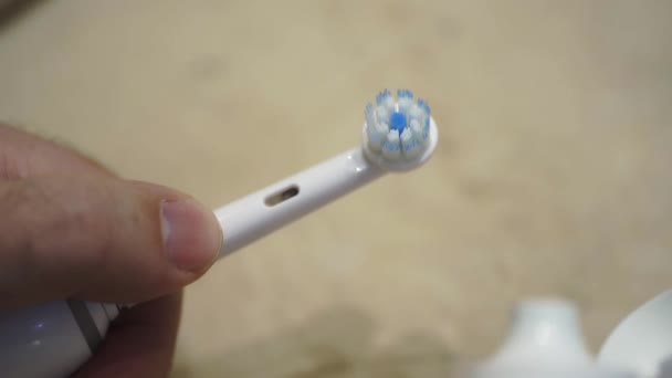 Macro Shot Mans Hand Pouring Toothpaste Electric Toothbrush — Vídeo de Stock