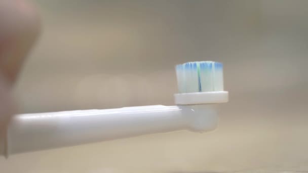 Macro Shot Mans Hand Pouring Toothpaste Electric Toothbrush — Stockvideo