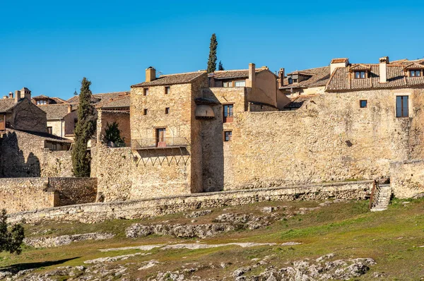 Medieval houses and walls of the old town of Pedraza located on a hill in the fields of Castile, Spain