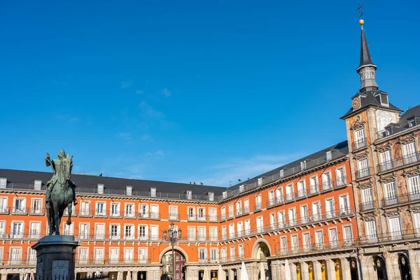 Historic buildings of the Plaza Mayor of Madrid with its towers, balconies and windows typical of the city, photo with copyspace