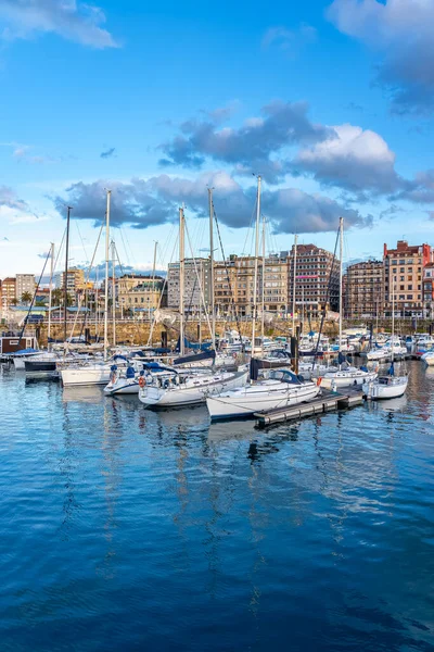 stock image Panoramic marina with many small sailing boats docked on the shore of the city of Gijon, Asturias, Spain