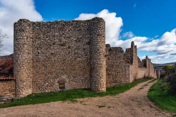 Medieval stone wall that surrounds the old town of Palazuelos in Castile-La Mancha