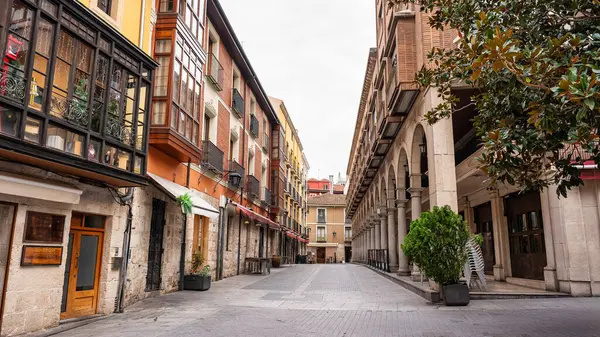Picturesque street in the city of Valladolid with arcades in historic buildings, Spain