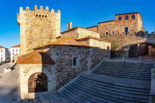 A group of medieval buildings next to the main square of Caceres, a World Heritage Site
