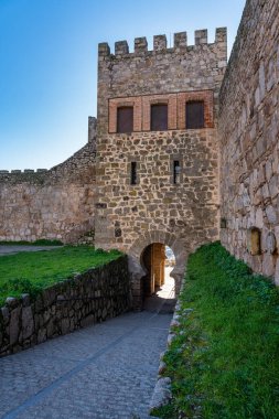Stone tower leading to the medieval citadel castle of the monumental city of Trujillo, Spain clipart