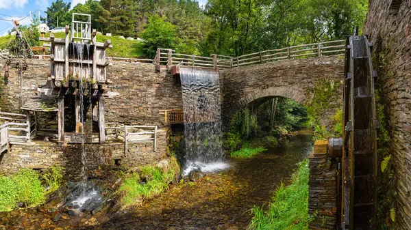 stock image Set of old wooden mills that take advantage of the water of the river to grind grain, Taramundi, Asturias