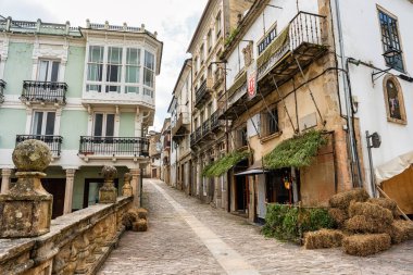 Narrow and picturesque streets with old houses in Mondonedo where pilgrims on the Camino de Santiago, Galicia clipart