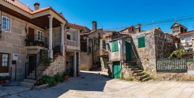 Old stone houses in the picturesque village of Combarro on the estuary of Pontevedra clipart