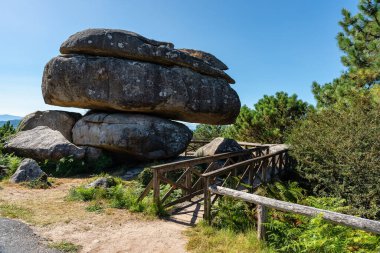 Impressive rocks at the top of the mountain with viewpoint of El Grove, Pontevedra, Galicia clipart