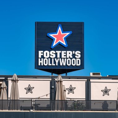 Madrid, Spain, December 21, 2024: Giant sign of the Fosters Hollywood restaurant brand in Plaza Norte, Madrid clipart