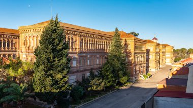 School buildings with early nineteenth-century architecture in Guadalajara, Spain clipart