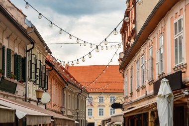 Narrow alleys decorated with strips of light bulbs in the city center of Maribor, Slovenia