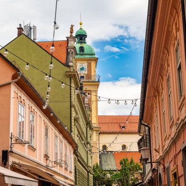 Narrow alleys decorated with strips of light bulbs in the city center of Maribor, Slovenia