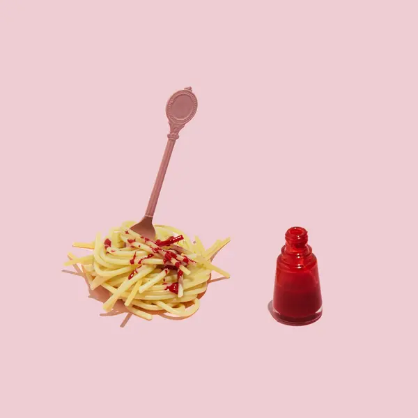 Creative beauty product and food concept, spaghetti and red nail polish bottle, pasta with tomato sauce idea.