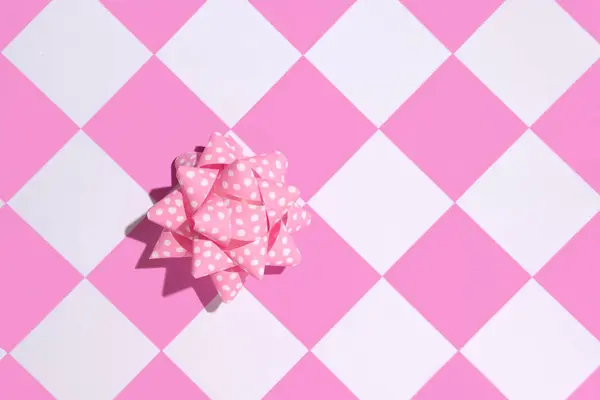 Creative aesthetic candy pink retro patterns. Gift box idea, checkered pattern, fifties nostalgia.