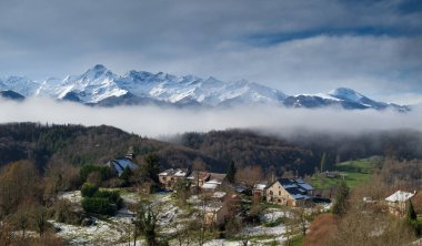 Mountain village in winter in the Arige Pyrenees in southwest France clipart