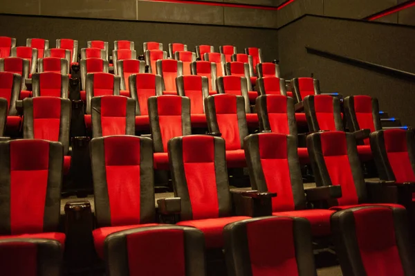 stock image empty cinema hall with red seats and chairs