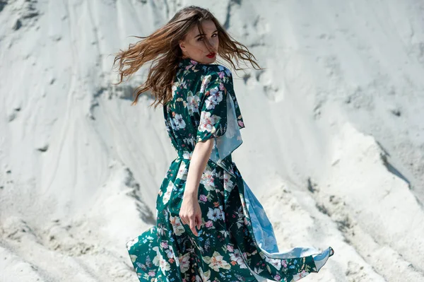 stock image beautiful young woman in a dress on the beach