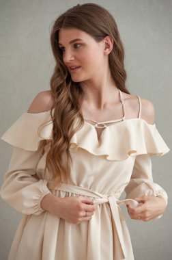 beautiful young woman in a white dress with a bow tie