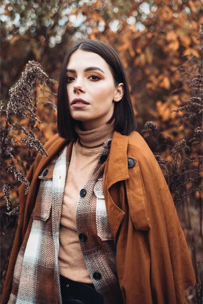 Stock image portrait of a young woman in a coat 