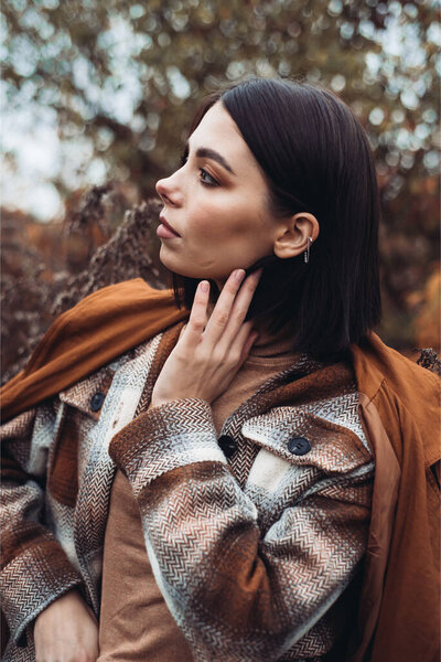 young woman in autumn forest 