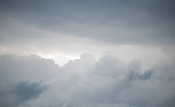 stock image dark storm clouds in a bright dark sky before the rain