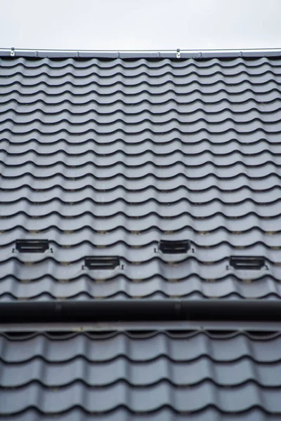 Black Roof Tiles House Royalty Free Stock Images