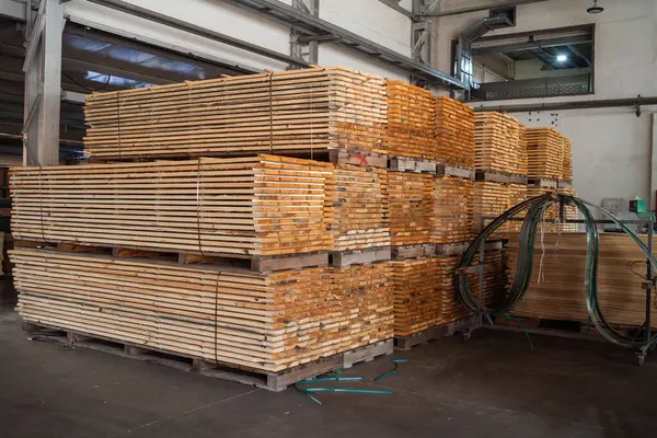 wood pallets stacked on wooden pallet in warehouse.