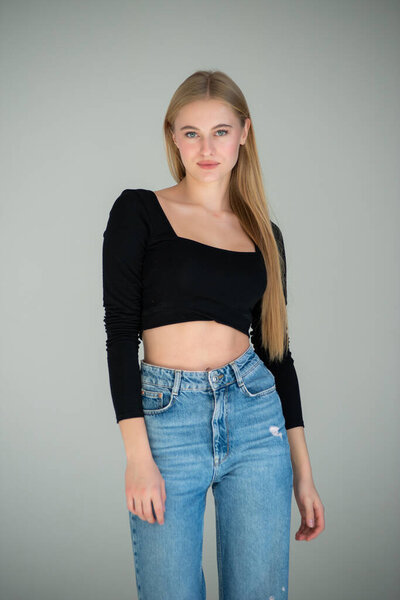portrait of attractive woman in blue jeans