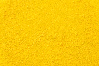 Metin veya reklam için boş telif alanına sahip sarı duvar arkaplanı ve dokusu.