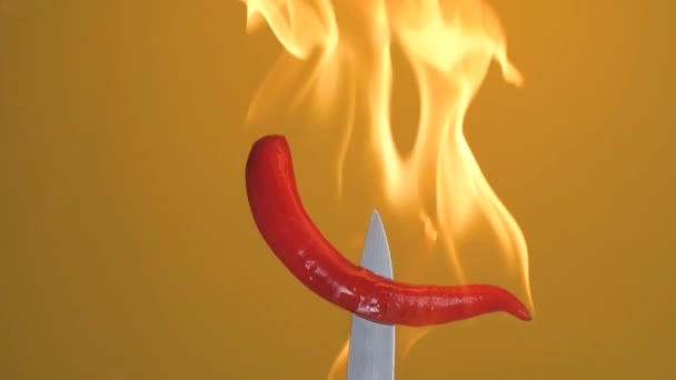 Hot Red Chili Pepper Fork Flames Orange Background Spicy Food — Vídeo de stock