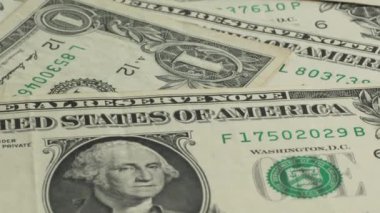 American one dollar paper money pile on desk. US Dollar bills one dollar bills background close-up. Concept of finance and money payment.